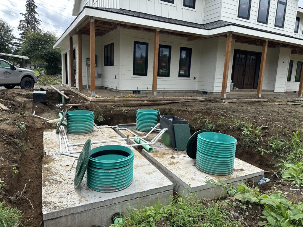 Modern Septic & Plumbing truck parked at a home during a drainfield repair service