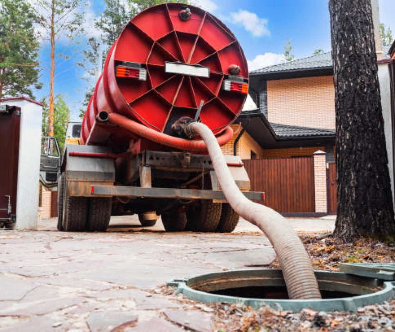 Modern Septic & Plumbing truck parked at a home during a drainfield repair service